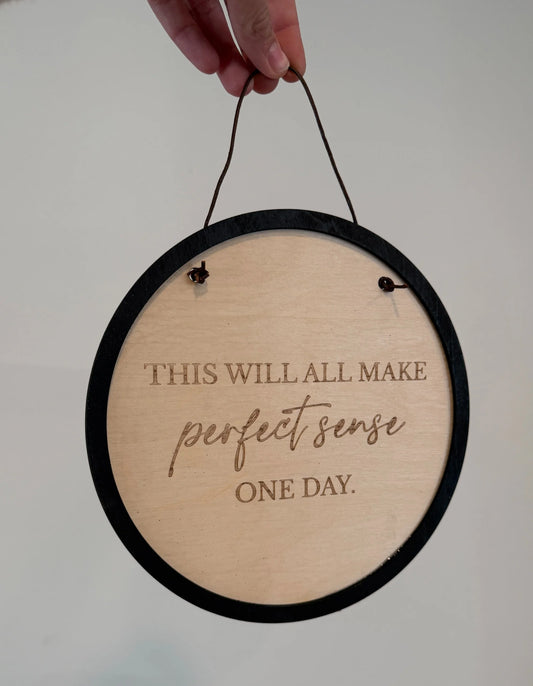 Round "This will all make" sign